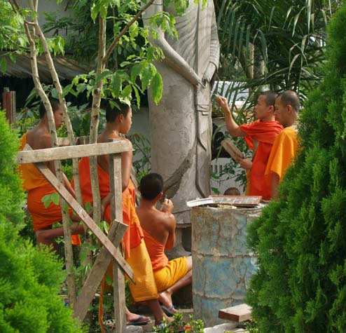Monks making a Buddha statue