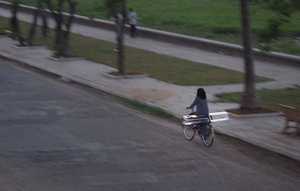 Woman cycling with ice