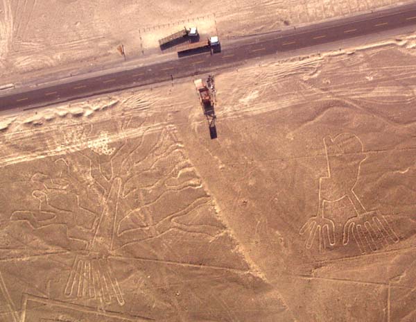 Nazca hands, tree, observation tower and Panamerican highway Nazca hands, tree, observation tower and Panamerican highway