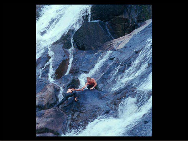 Marco helping Maria up the falls