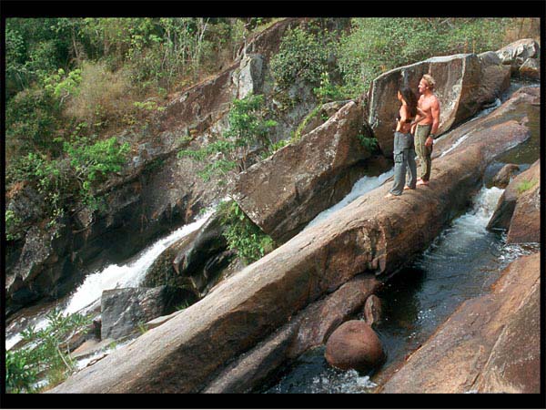 Maria and Marco looking out over the forests from the top of the waterfall.