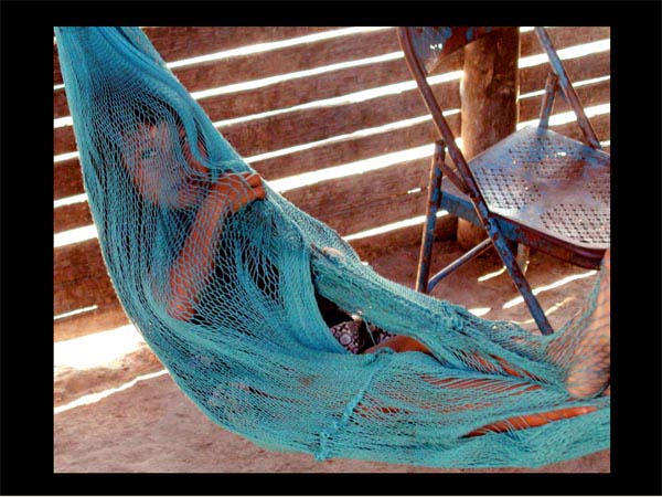 Girl wrapped in hammock - shy but watchful