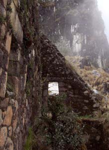 Second story of the front half of Inca Wasi, with the cliffs of the adjacent peak in background