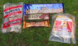 Image of lunch showing walnuts, turrón, muesli bars and cheese