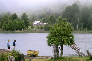 Laguna los Quetros, campspot with boat to collect water or fish, and farm house across the way for food and to pay for the campsite